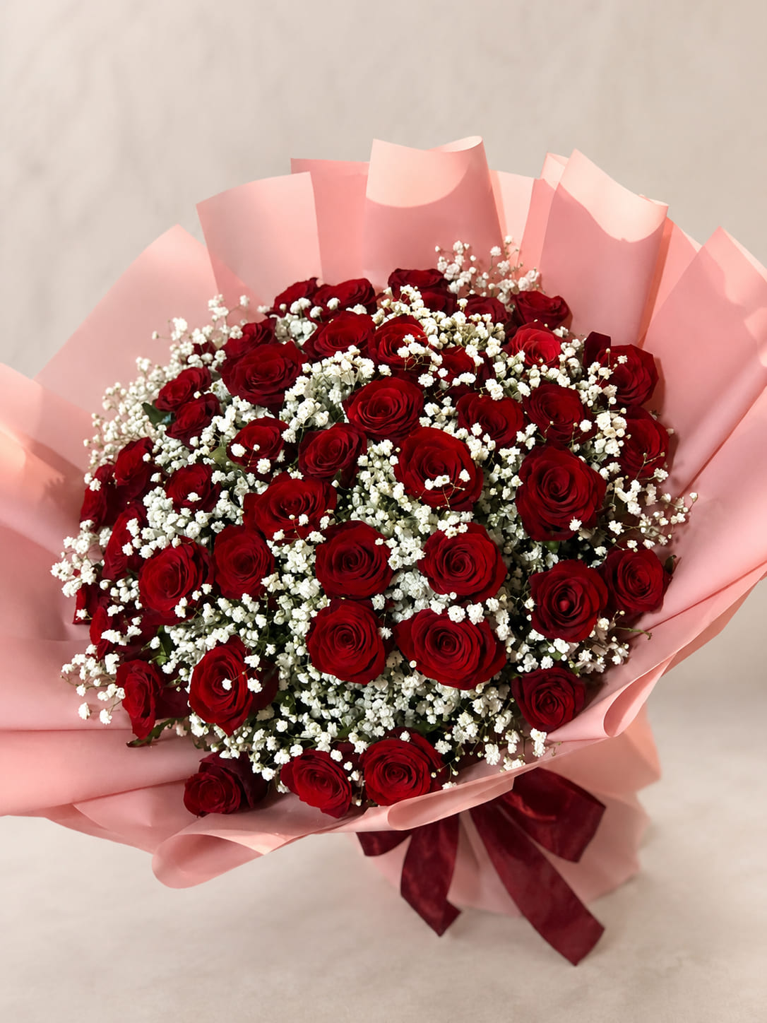 Luxury red rose bouquet with pink wrapping for delivery in Rabat Morocco